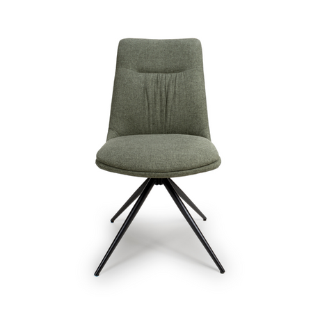 The Boden Chair in Sage Green features soft fabric upholstery, pleated accents, robust black metal legs along