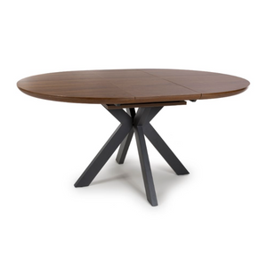 The Boston Extending Table, which can be adjusted from 1200 to 1600mm, showcases a luxurious smoked oak veneer, robust metal legs and a seamless extension