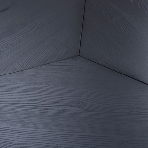 The Boston Round Table 1500mm in Black Ash features a generous design, an elegant veneer surface, and a distinctive X-leg base.