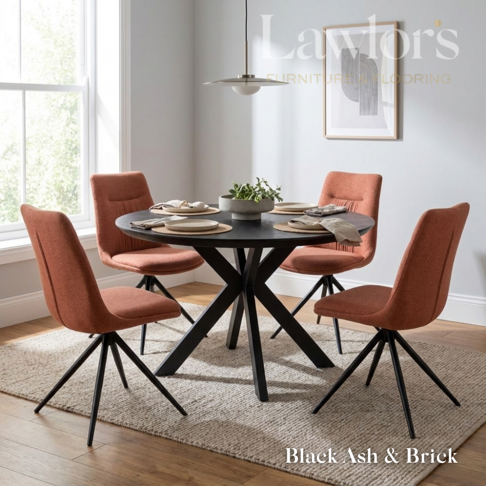Dining room with black extending round table and orange chairs set