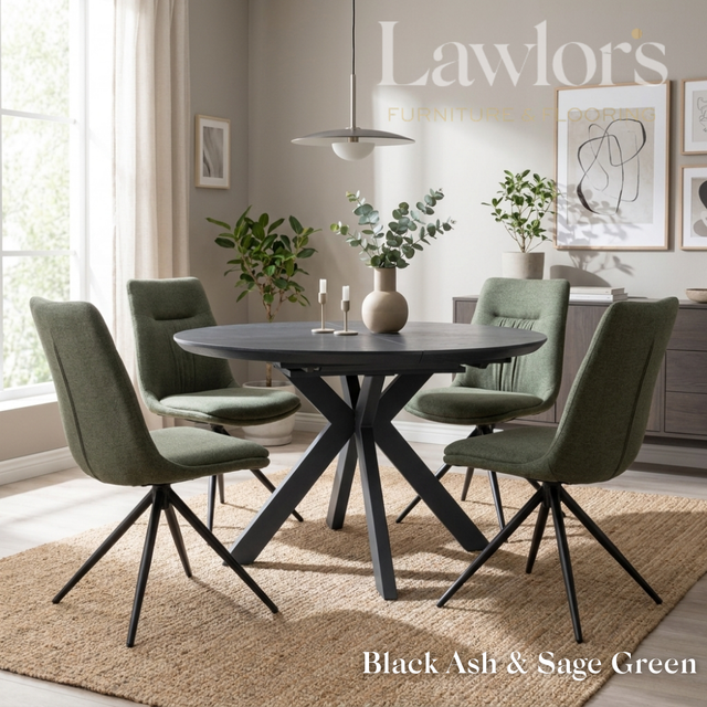 Dining room with black extending round table and sage green chairs set