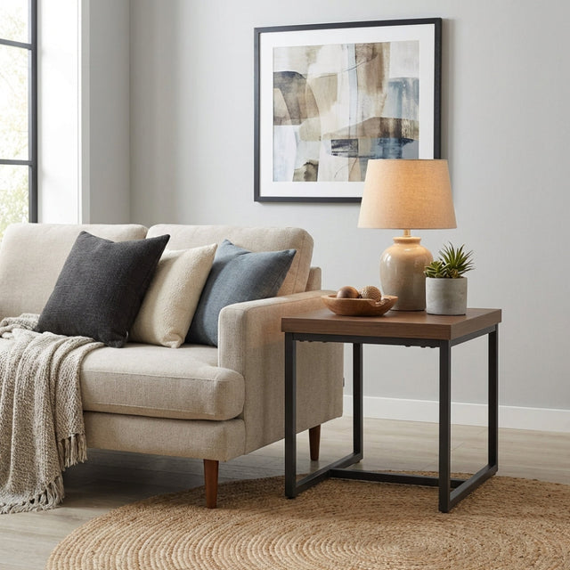 The Boston End Table in Smoked Oak boasts a robust SmarTops® surface, resilient iron legs and a stylishly compact design to compliment any decor.