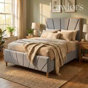 Bedroom with a gray upholstered bed, beige bedding