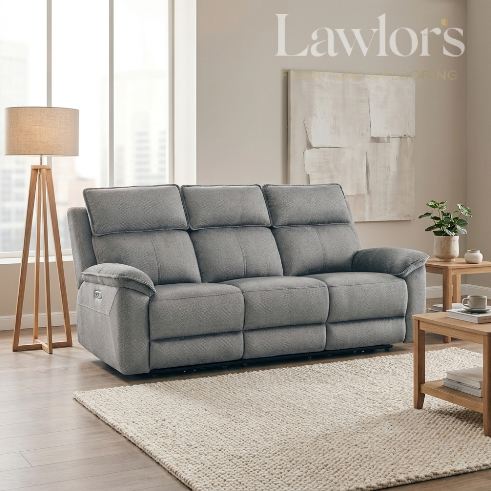 Grey 3 seater electric recliner sofa in a living room setting