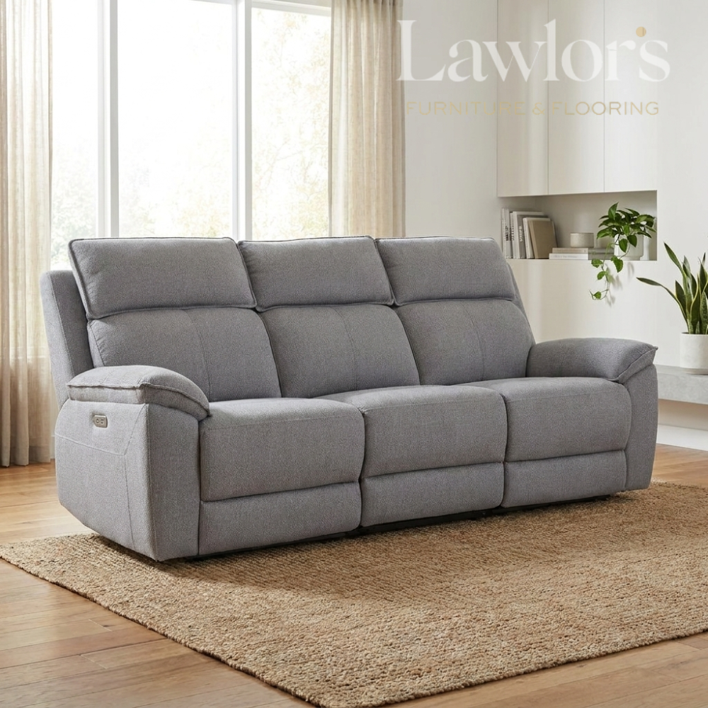 Grey 3 seater electric recliner sofa in a living room
