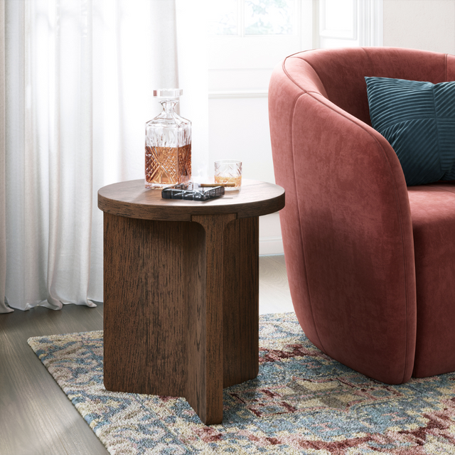 The California Round Side Table is crafted from oak and rubberwood veneer with a sleek, natural finish, stylish for any room.
