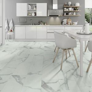White marble-look floor tiles with gray veining in a modern kitchen setting.