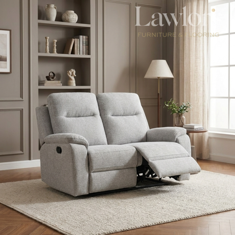 Light grey 2 seater recliner sofa in a living room setting