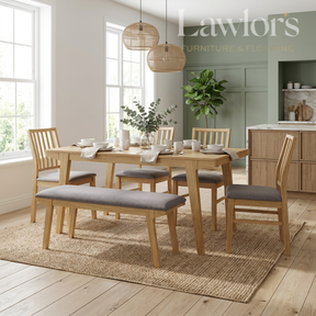 Dining room with wooden table, chairs, and bench on a rug