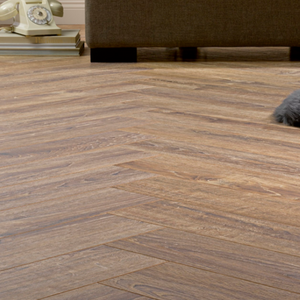 The Cork Herringbone Laminate Flooring - 12mm features herringbone design, AC6 durability and underfloor heating compatible.