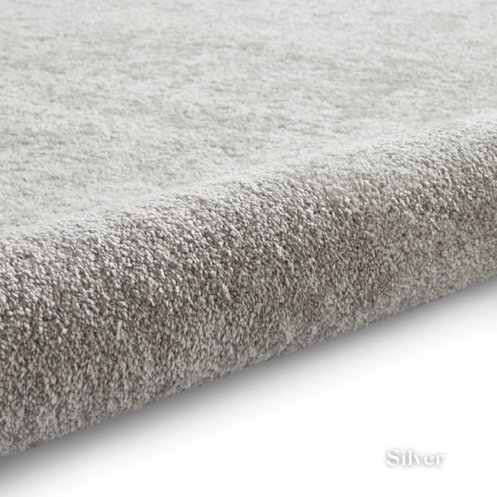 Brighten you room with the Cove Washable Collection Machine Made Rugs featuring washable design, soft shaggy pile and stain resistant