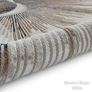 Elevate your style with the Creation Modern Abstract Machine Made Rugs Range featuring metallic yarn, textured piles and artistic pattern.