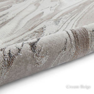 Elevate your style with the Creation Modern Abstract Machine Made Rugs Range featuring metallic yarn, textured piles and artistic pattern.