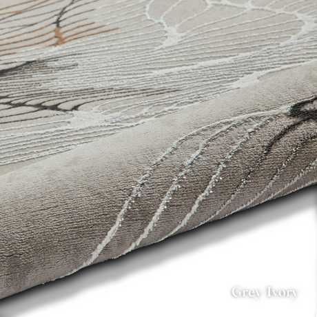 Elevate your style with the Creation Modern Abstract Machine Made Rugs Range featuring metallic yarn, textured piles and artistic pattern.