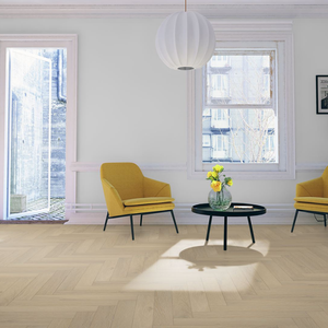 The Denver Oak Herringbone Laminate Flooring - 12mm features soft oak tones, AC4 durability, V Groove Bevel, embossed texture and easy DocLoc installation