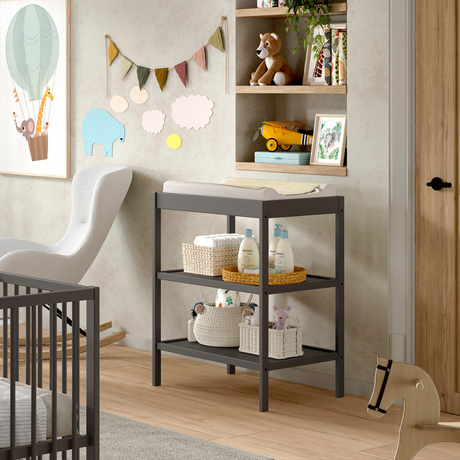 The Dino Baby Changing Table in Anthracite features a open shelves with European beech material, making it easily accessible for baby essentials