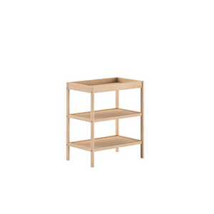 The Dino Baby Changing Table in Natural features a European beech material with open shelves, making it easily accessible for baby essentials