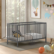 The Dino Baby Cot Bed 70 x 140cm in Anthracite features removable bars, 3 height adjustable slat base, European beech material and toddler bed conversion