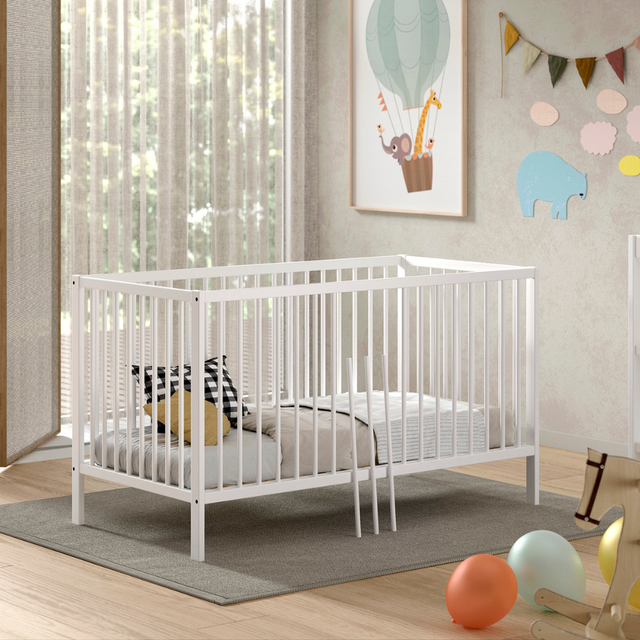 The Dino Baby Cot Bed 70 x 140cm in White features 3 height adjustable slat base, European beech material, removable bars and toddler bed conversion