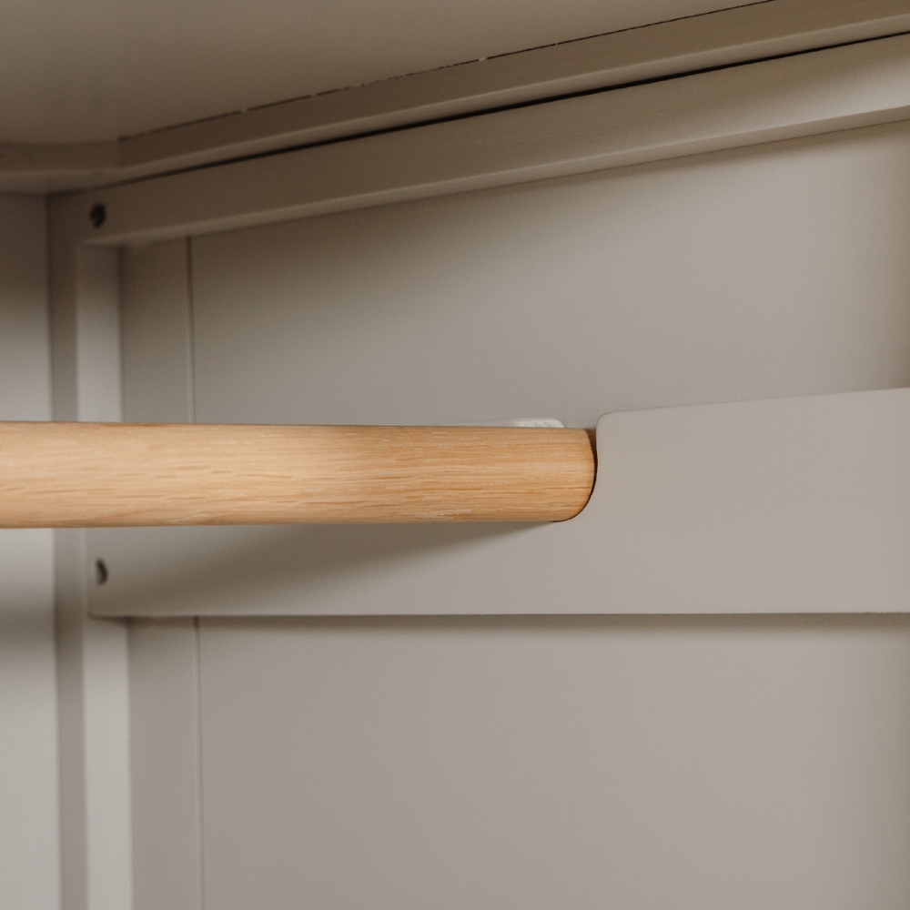 The Doune 2-Door Wardrobe in Taupe features oak veneer top, spacious hanging rail, and sleek metal handles.