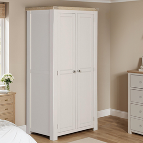 The Doune 2-Door Wardrobe in Taupe features oak veneer top, spacious hanging rail, and sleek metal handles.