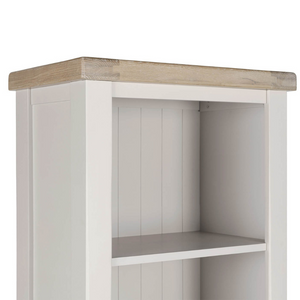 The Doune Tall Bookcase in Taupe features sleek design, oak veneer top and a hidden cabinet storage.