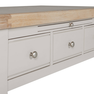The Doune Coffee Table in Taupe features oak veneer top, three storage drawers with sleek handles and a versatile design.