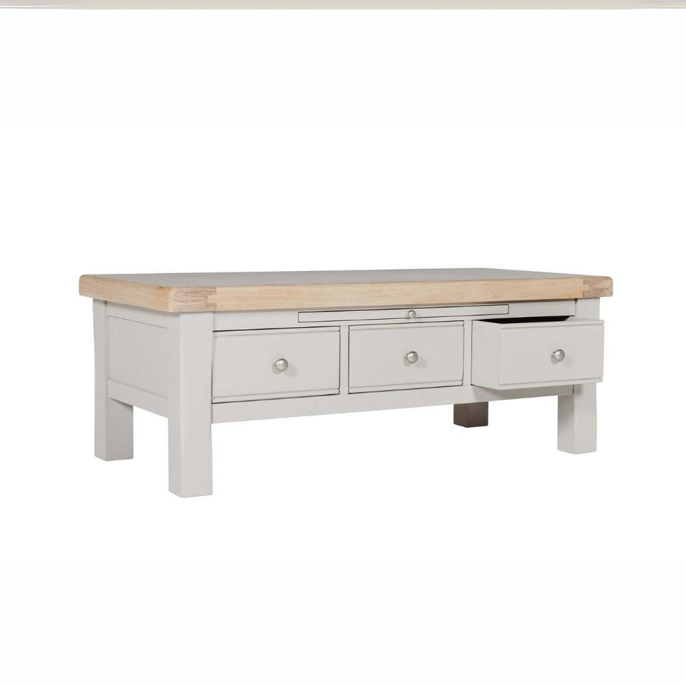 The Doune Coffee Table in Taupe features oak veneer top, three storage drawers with sleek handles and a versatile design.