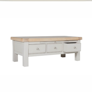 The Doune Coffee Table in Taupe features oak veneer top, three storage drawers with sleek handles and a versatile design.