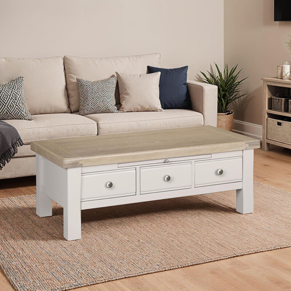The Doune Coffee Table in Taupe features oak veneer top, three storage drawers with sleek handles and a versatile design.