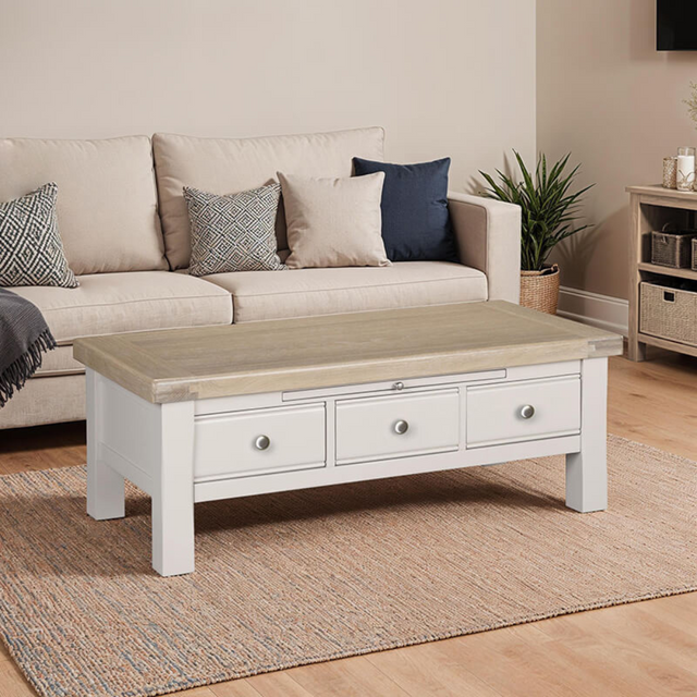 The Doune Coffee Table in Taupe features oak veneer top, three storage drawers with sleek handles and a versatile design.