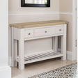 The Doune Console Table in Taupe features a sleek taupe finish, design with three drawers and a lower slatted shelf.
