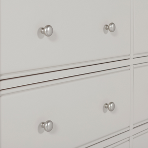 The Doune 6-Drawer Dressing Chest in Taupe features 6 spacious drawers, oak veneer top and sleek metal handles.