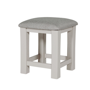 The Doune Dressing Stool in Taupe features padded cushion seat and elegant painted finish; perfect for bedroom or vanity space.