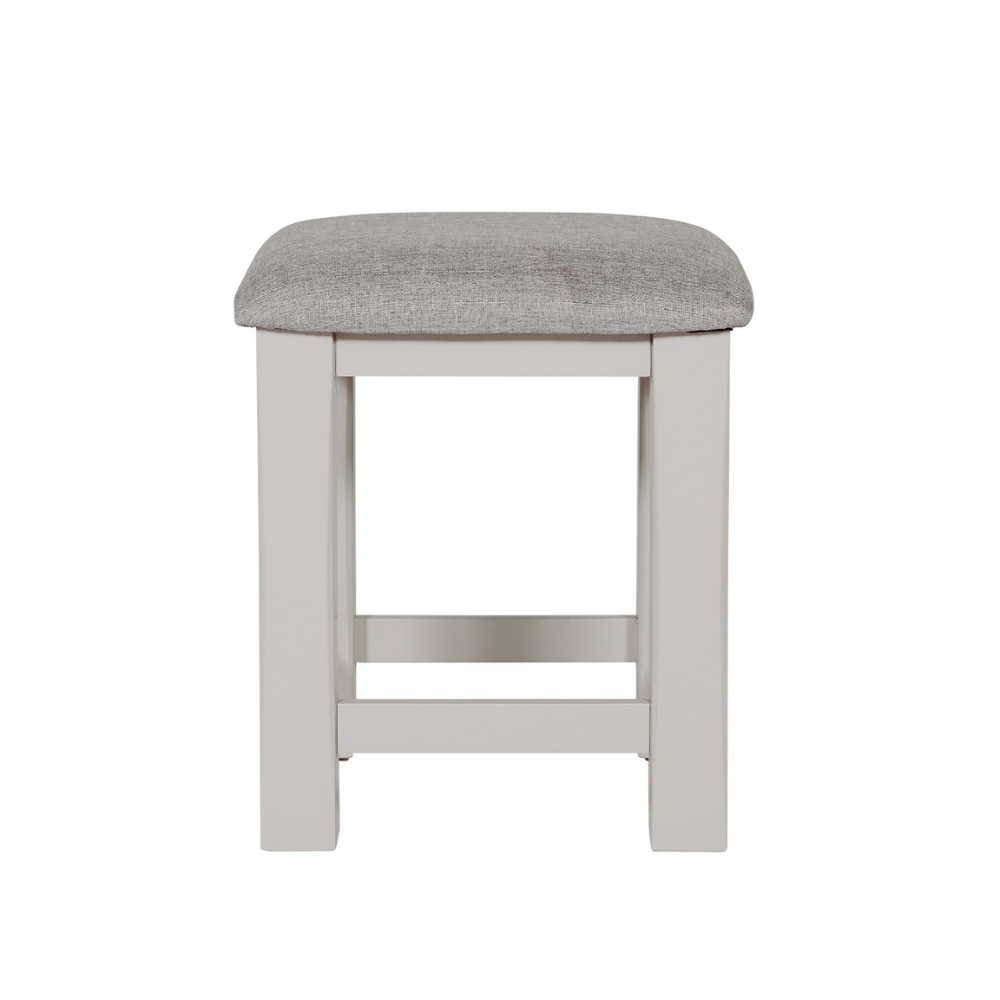 The Doune Dressing Stool in Taupe features padded cushion seat and elegant painted finish; perfect for bedroom or vanity space.