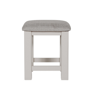 The Doune Dressing Stool in Taupe features padded cushion seat and elegant painted finish; perfect for bedroom or vanity space.