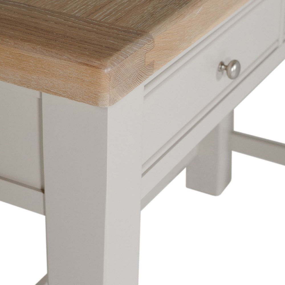 The Doune Dressing Table in Taupe features oak veneer top, 2 drawers and sleek metal handles, practical for any dressing space.