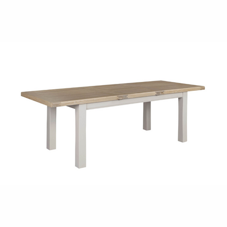 The Doune Extendable Dining Table in Taupe, 1800-2460mm features oak top, taupe-painted legs, and smooth extension mechanism.