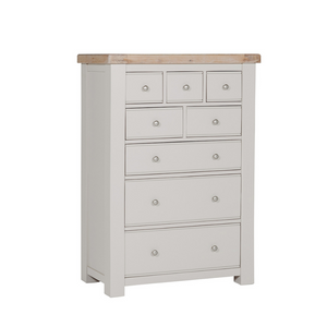 The Doune Tall Chest 8 Drawer in Taupe features oak veneer top and metal handles; ample storage with a chic finish.