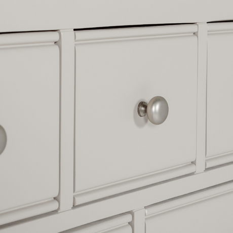 The Doune Tall Chest 8 Drawer in Taupe features oak veneer top and metal handles; ample storage with a chic finish.