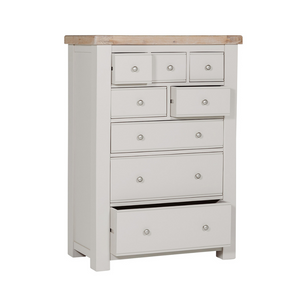 The Doune Tall Chest 8 Drawer in Taupe features oak veneer top and metal handles; ample storage with a chic finish.
