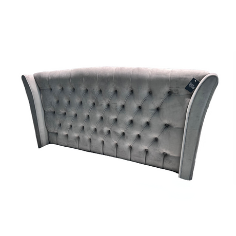 The Eclipse Fabric Headboard - 56" features arched winged with deep buttons, custom fabric and floor standing with chrome gliders, ideal for any bed!