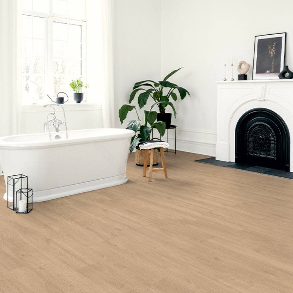 The Elba Oak Gold Laminate Flooring - 12mm features AC5 durability, Aqua Pearl spill resistance and light oak