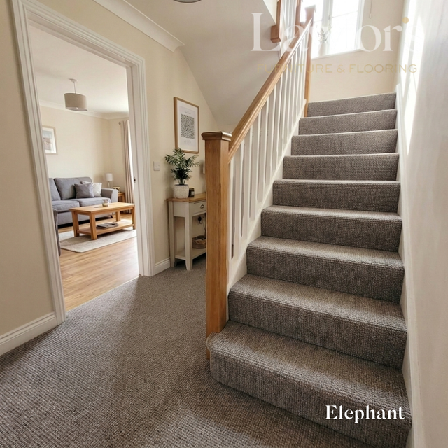 Staircase with carpeted steps leading to a living room