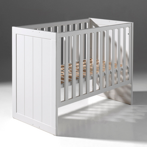 The Erik Baby Cot Bed 60 x 120cm in White features a adjustable slat base with 3 heights, stylish vertical grooves and durable MDF design