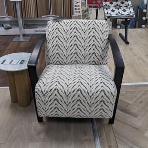 The Falcon Accent Chair features a bold patterned fabric, sleek black wooden arms and deep cushioning for a stylish and comfortable statement to any room