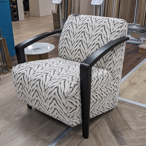 The Falcon Accent Chair features a bold patterned fabric, sleek black wooden arms and deep cushioning for a stylish and comfortable statement to any room