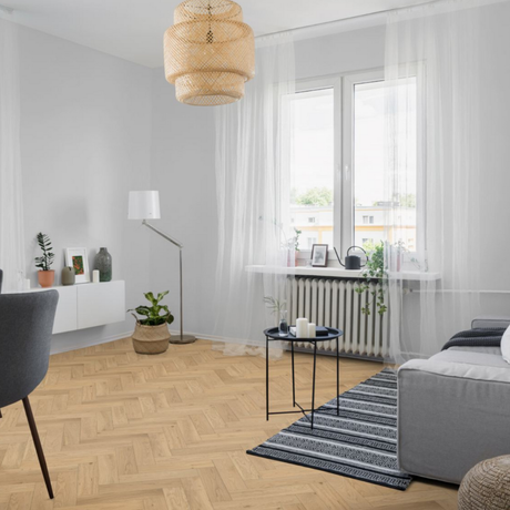 The Whisper Oak Herringbone Engineered Flooring - 15mm features warm oak tones, modern herringbone design and durable multi layer construction