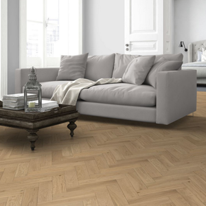 The Whisper Oak Herringbone Engineered Flooring - 15mm features warm oak tones, modern herringbone design and durable multi layer construction