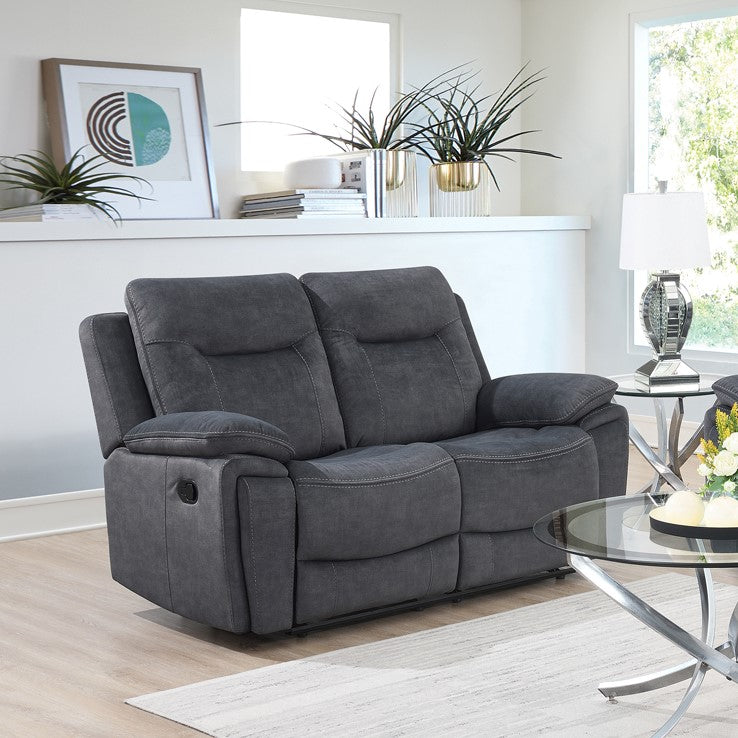 The Edison Recliner Sofa in Grey features easy-clean fabric, electric reclining, drop-down tray with cup holders, wireless charging.